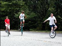 3 unicyclists
